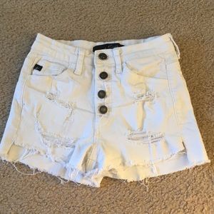 Distressed white shorts